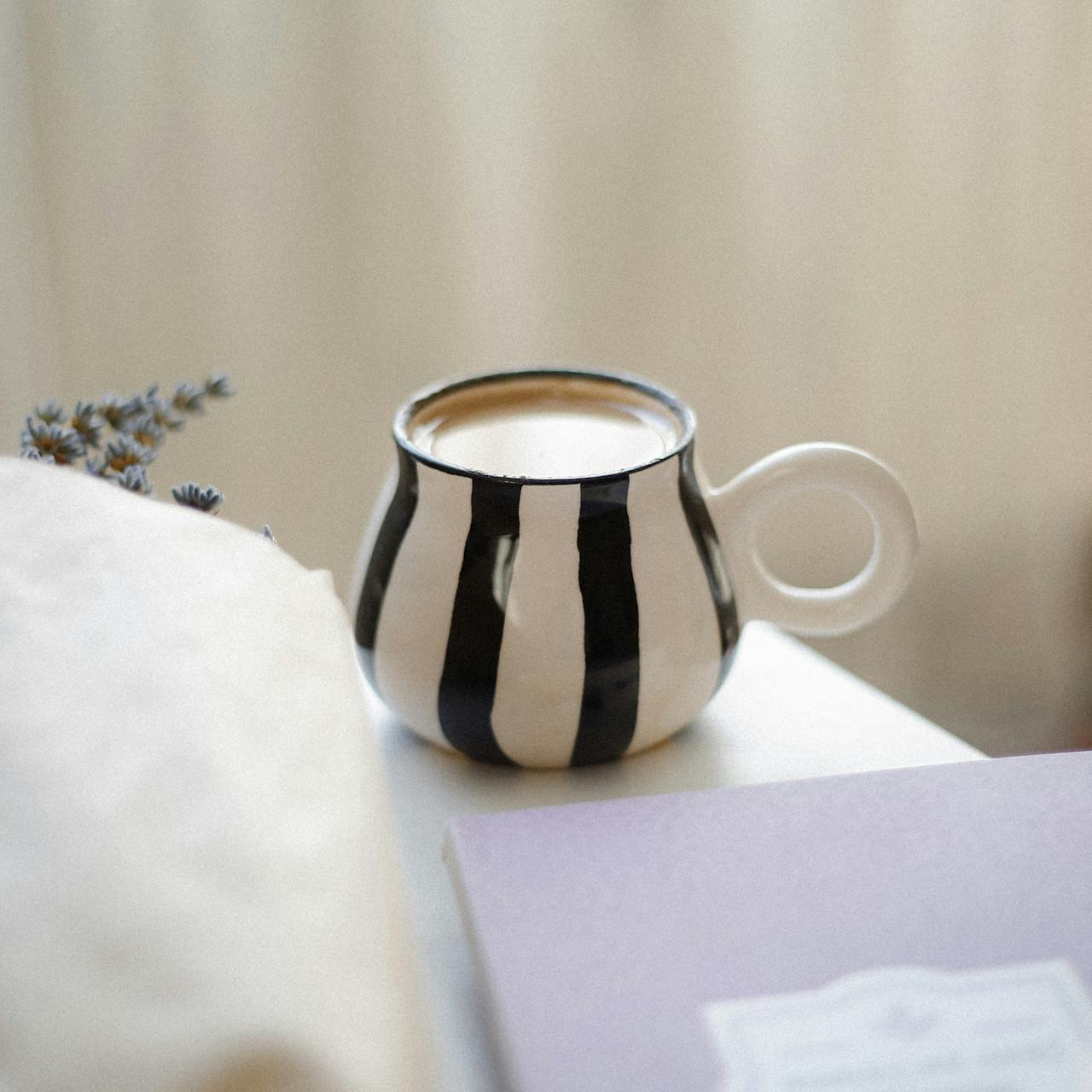 Black and White Ceramic Mug with Tea
